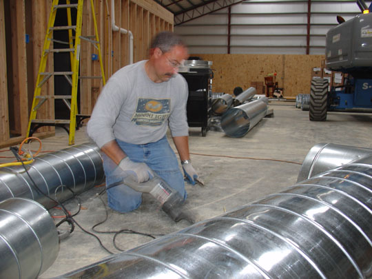 Joe Wilson, creating ductwork so the heat could flow in the Freedom Barn